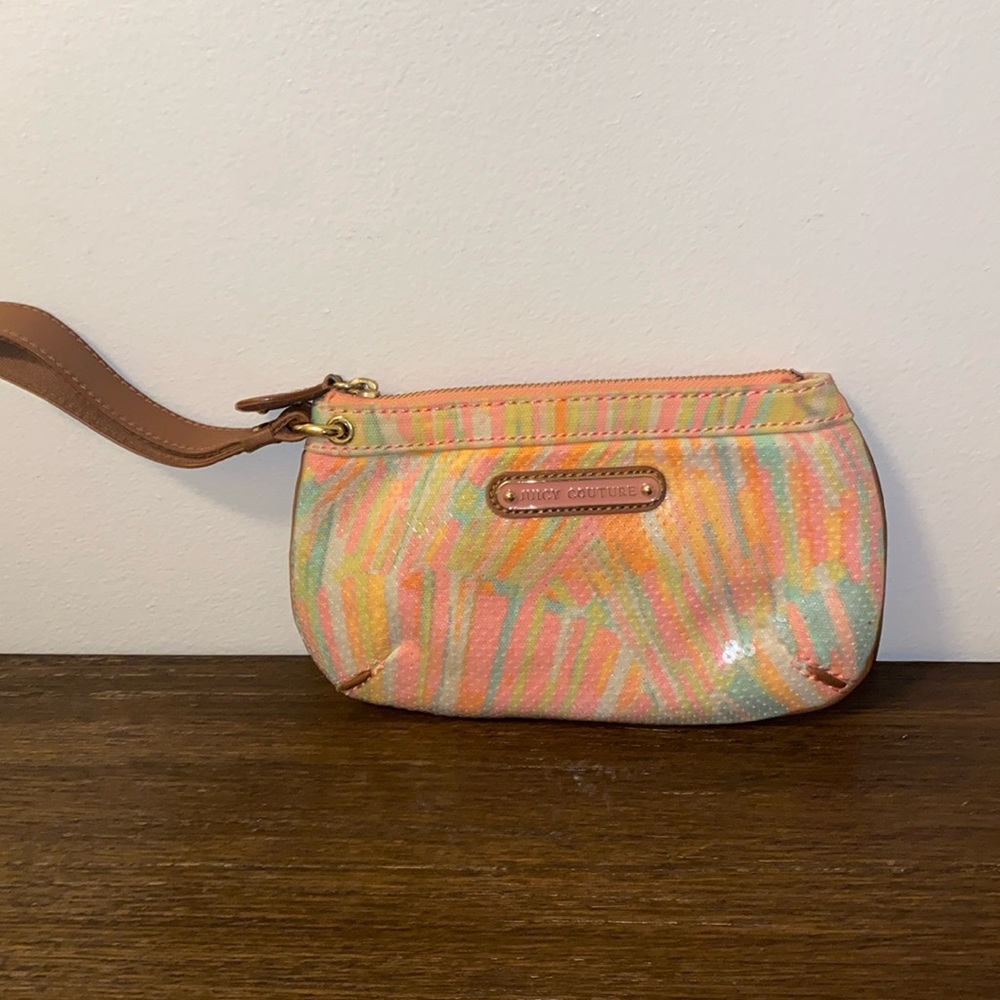 Sequenced juicy couture wristlet.